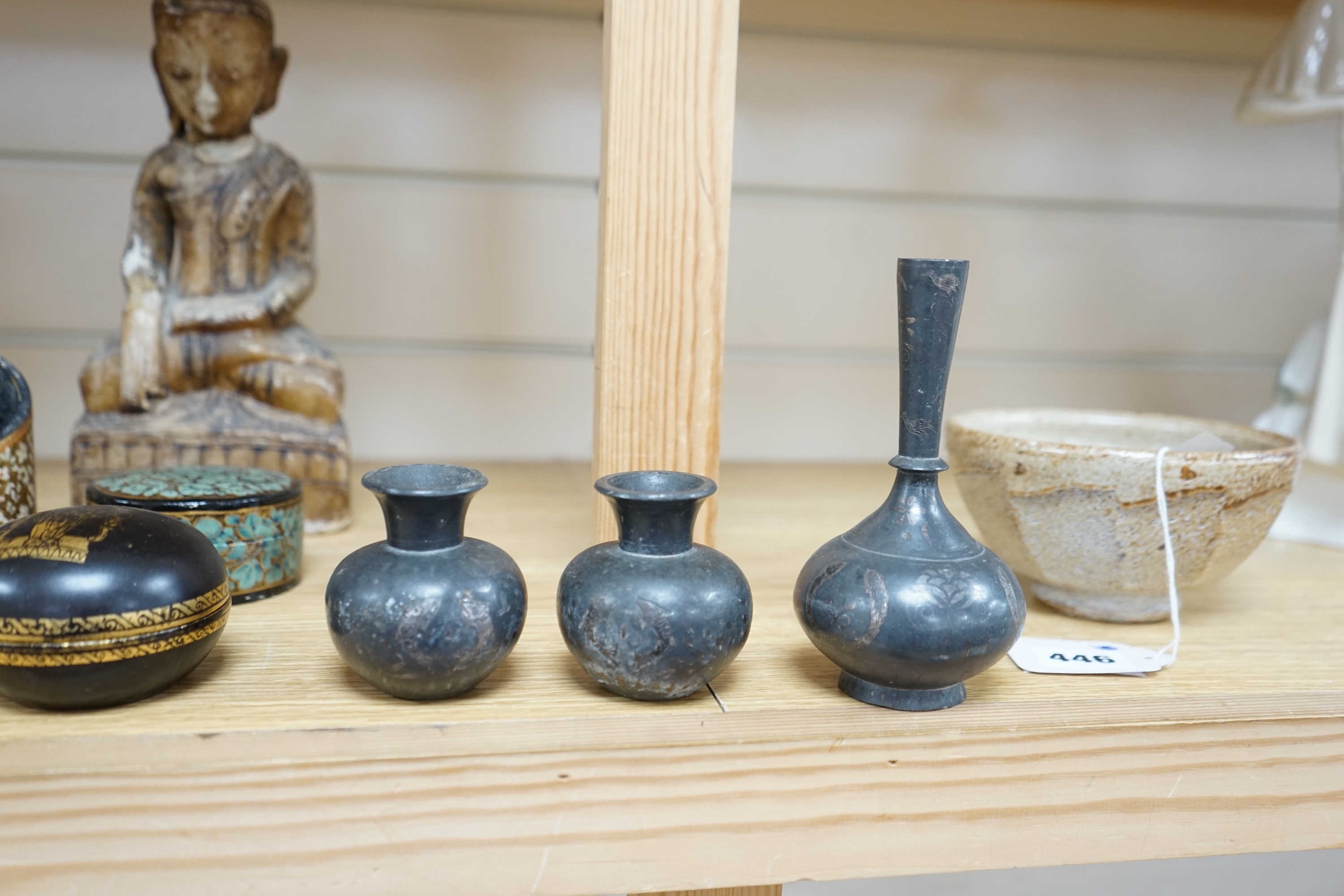 A collection of South East Asian and Indian collectables to include Bidri ware, alabaster Buddha and four papier mache pots, largest 26cm high. Condition - mostly fair